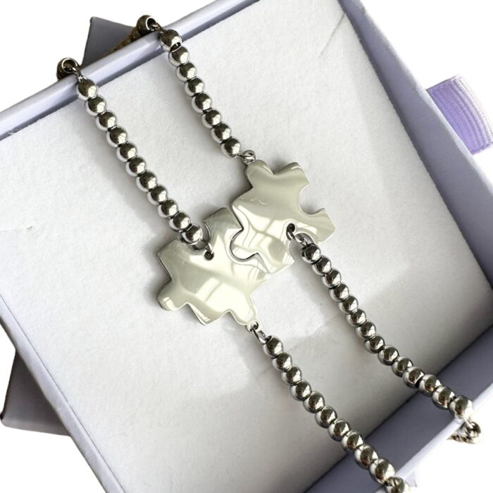 BAA7C58F-00A7-47D9-8B6A-66D9EF76162A Coppia bracciali puzzle - immagine 2